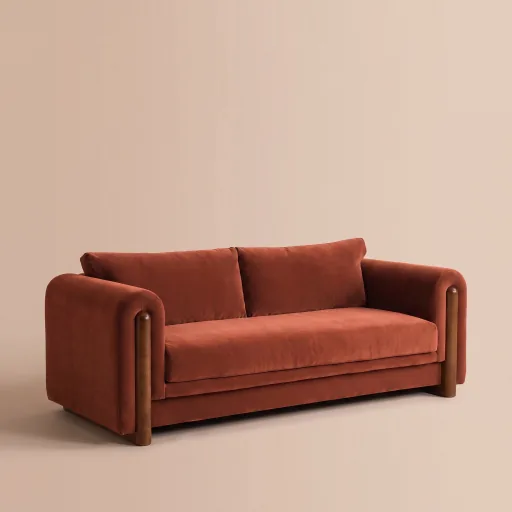 The rust velvet sofa as a studio packshot